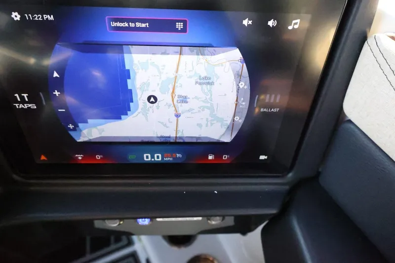 Slide: The Image of 2026 Tigé 24RZX dashboard display showing navigation map and controls. - 26