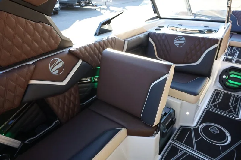 Slide: The Image of Luxurious interior of 2026 Tigé 24RZX boat with brown diamond-stitched seating. - 44
