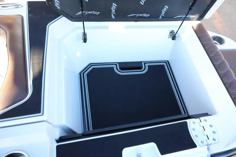 Slide: The Image of 2026 Tigé 24RZX boat storage compartment with cushioned seating and sleek design. - 51
