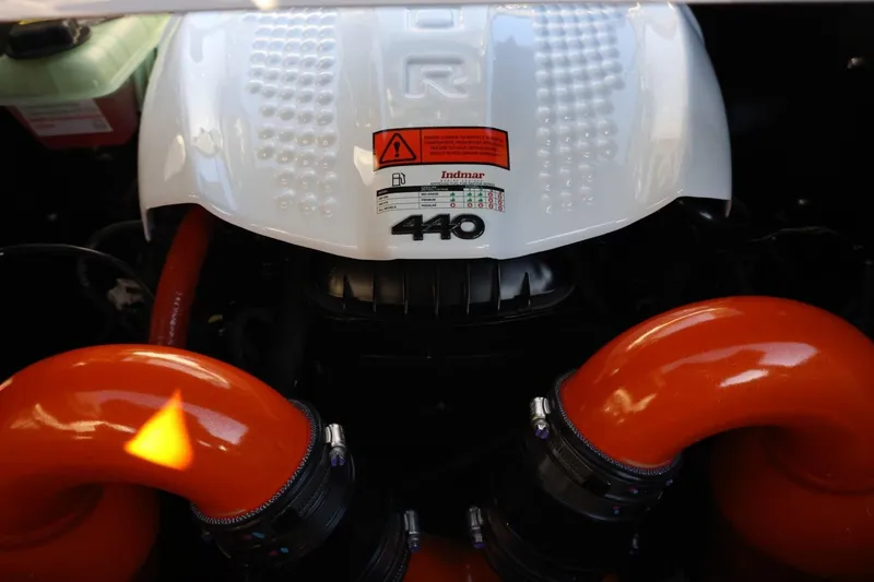 Slide: The Image of Engine of 2026 Tigé 24RZX boat with Indmar 440 horsepower, featuring orange intake pipes. - 53