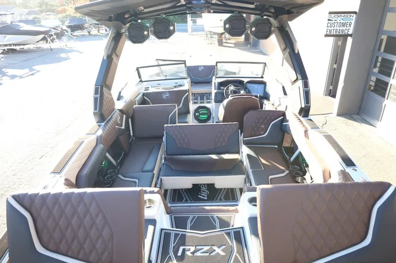 Slide: The Image of 2026 Tigé 24RZX boat interior with luxurious seating and advanced audio system. - 55