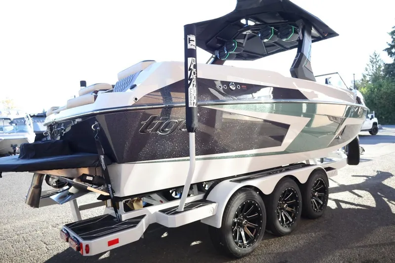 Slide: The Image of 2026 Tigé 24RZX boat on a trailer, showcasing sleek design and modern features. - 6