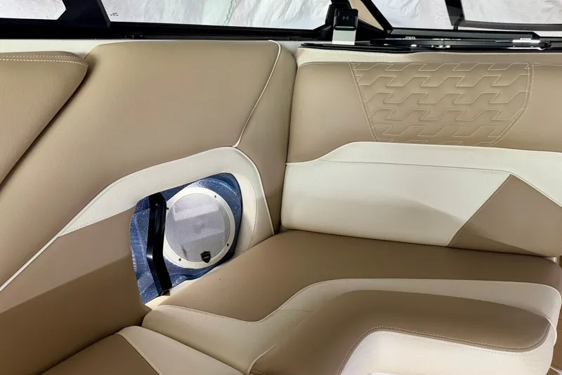 Slide: The Image of 2025 Centurion Ri245 interior with beige and white leather seating, featuring a built-in speaker. - 14