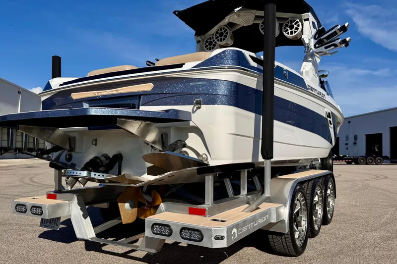 Slide: The Image of 2025 Centurion Ri245 boat on trailer, showcasing sleek design and advanced features. - 16