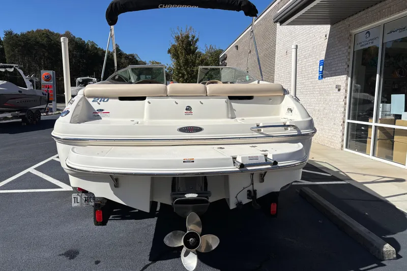 Slide: The Image of 2007 Chaparral 210 SSi boat, rear view, parked outdoors near a building. - 5