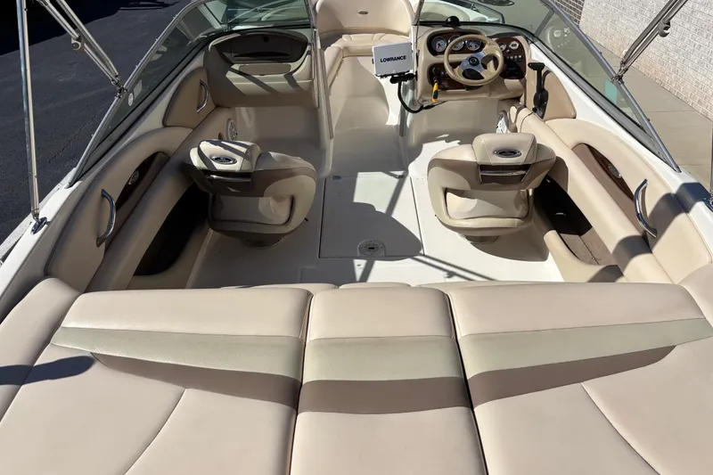 Slide: The Image of Interior of a 2007 Chaparral 210 SSi boat with beige seating and steering console. - 6