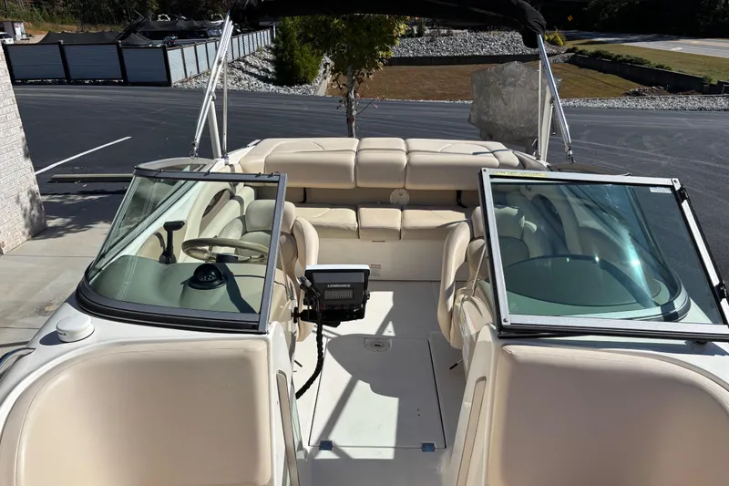 Slide: The Image of 2007 Chaparral 210 SSi boat interior with beige seating and open windshield. - 7
