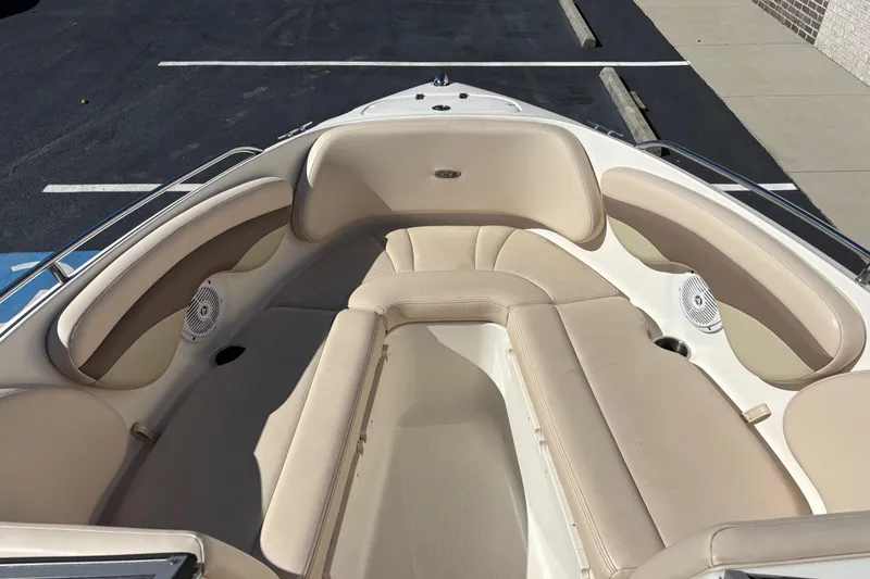 Slide: The Image of 2007 Chaparral 210 SSi boat interior with beige seating and speakers. - 8
