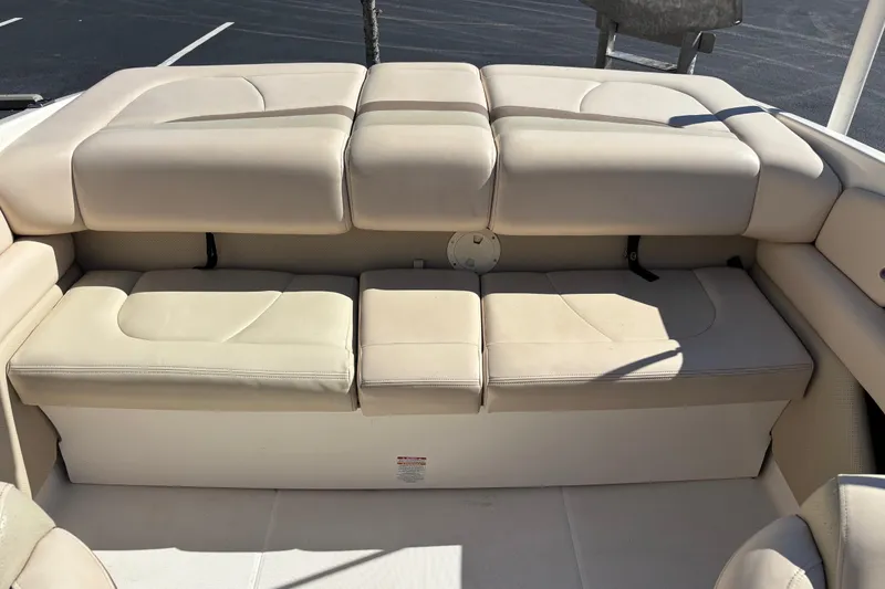 Slide: The Image of 2007 Chaparral 210 SSi boat interior with beige cushioned seating. - 9