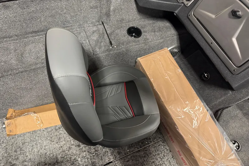 Slide: The Image of 2026 Tracker Pro Guide V-175 Combo boat interior with seat and packaged item. - 10