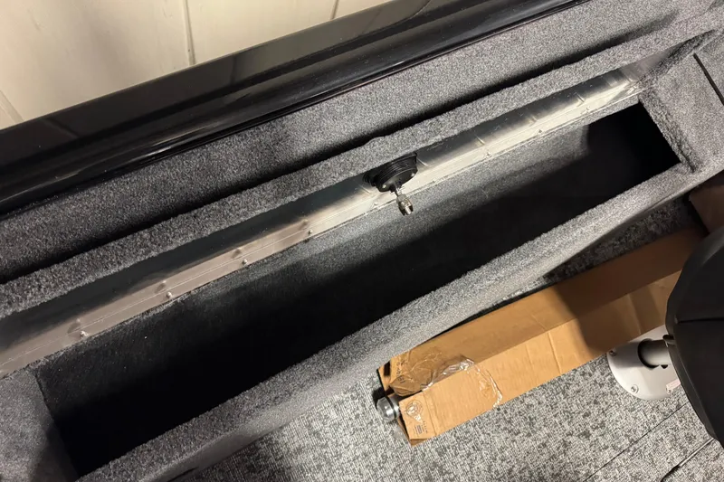 Slide: The Image of 2026 Tracker Pro Guide V-175 Combo interior storage compartment with key lock. - 11