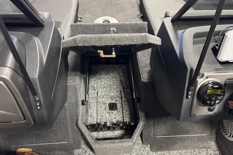 Slide: The Image of 2026 Tracker Pro Guide V-175 Combo boat interior with open storage compartment. - 13