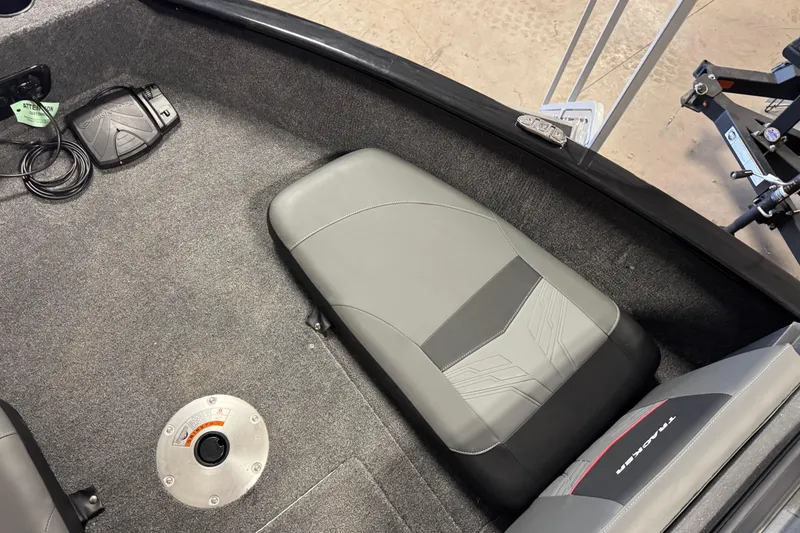 Slide: The Image of 2026 Tracker Pro Guide V-175 Combo boat interior with gray seating and foot pedal. - 15