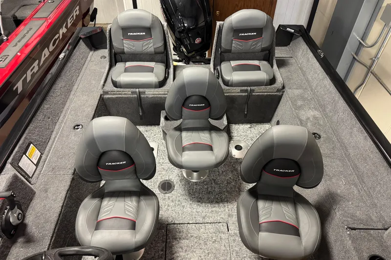 Slide: The Image of 2026 Tracker Pro Guide V-175 Combo boat interior with five gray seats. - 5