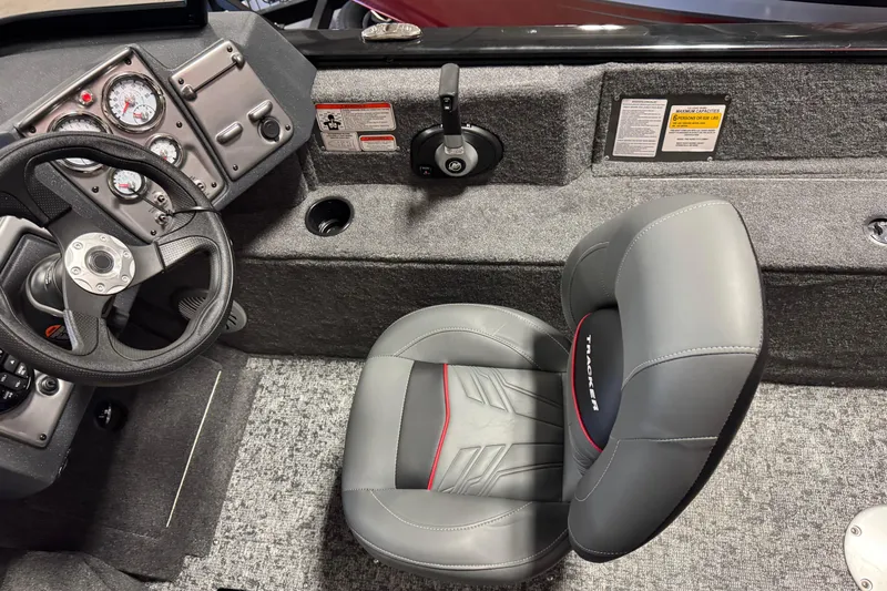Slide: The Image of Interior of 2026 Tracker Pro Guide V-175 Combo boat with steering wheel and seat. - 8
