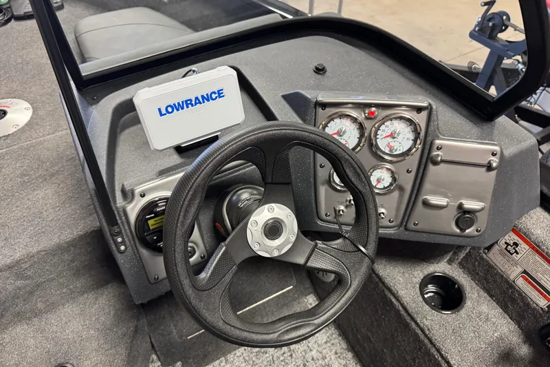 Slide: The Image of 2026 Tracker Pro Guide V-175 Combo boat dashboard with Lowrance display and gauges. - 9