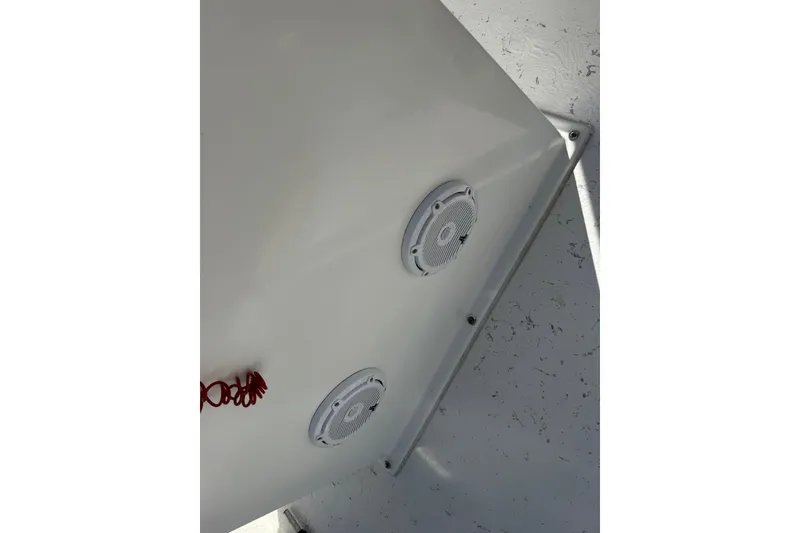 Slide: The Image of 2023 C-Hawk 23 Center Console boat interior with speakers and textured flooring. - 14