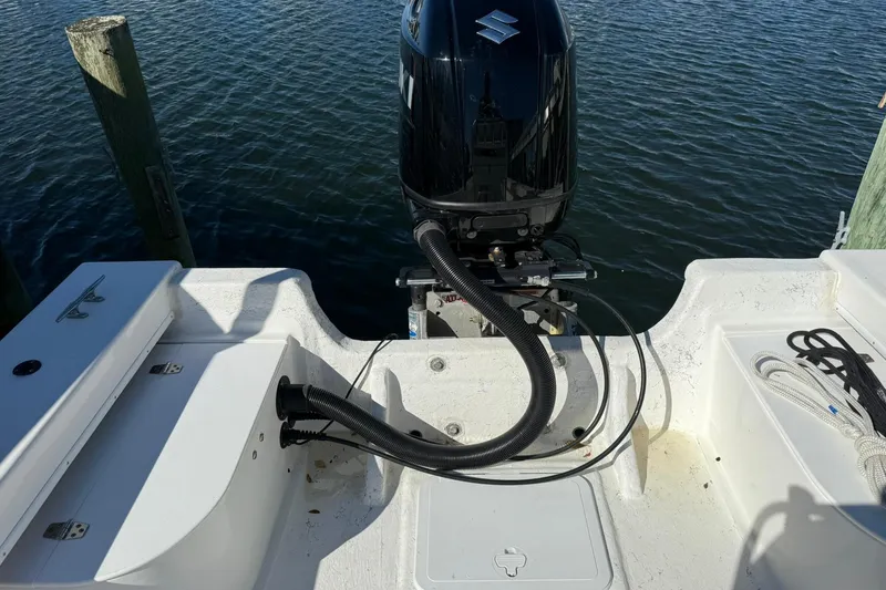 Slide: The Image of 2023 C-Hawk 23 Center Console boat with Suzuki outboard motor on water. - 17