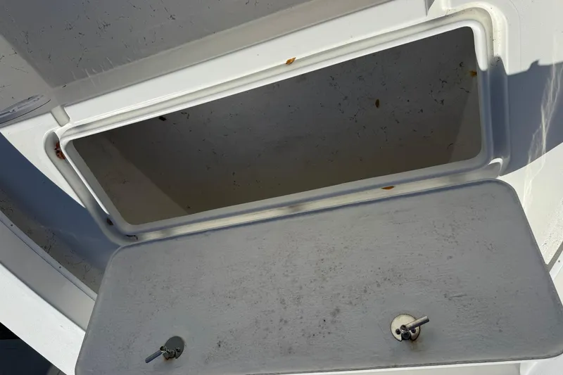 Slide: The Image of Open storage compartment on 2023 C-Hawk 23 Center Console boat. - 20