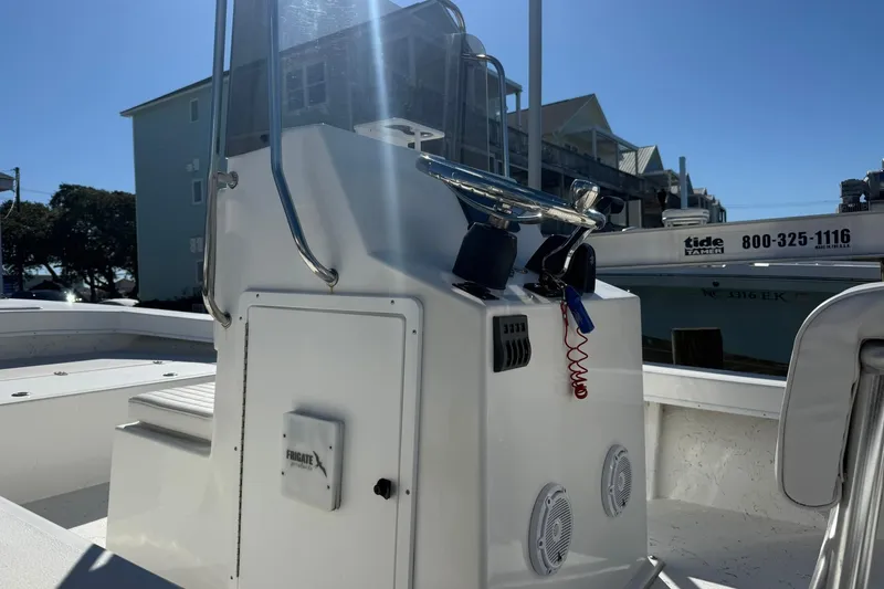 Slide: The Image of 2023 C-Hawk 23 Center Console boat with steering console and marine speakers. - 6