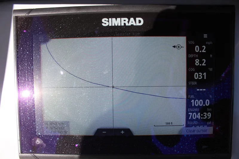 Slide: The Image of Simrad navigation display on 2024 Bayliner CC22 boat, showing speed, depth, and course data. - 23