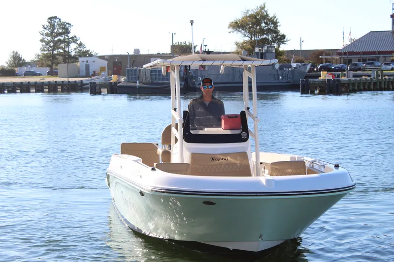 Slide: The Image of 2024 Bayliner CC22 boat on water, featuring a sleek design and canopy. - 7