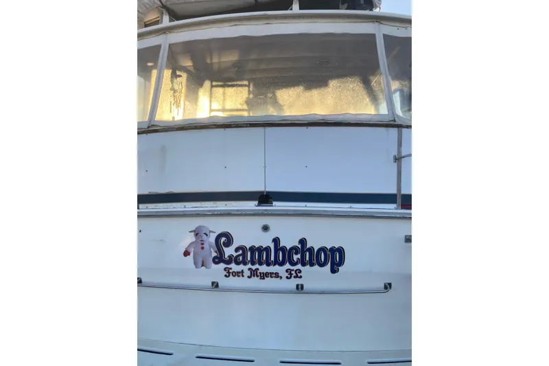 Slide: The Image of 1985 Bertram 58 Flybridge yacht named "Lambchop" in Fort Myers, FL. - 4