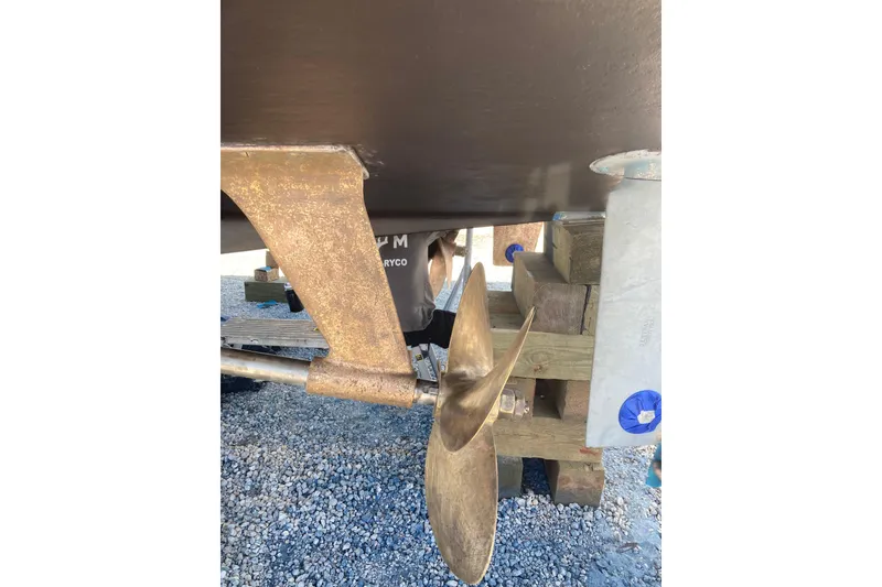 Slide: The Image of Propeller and rudder of 1985 Bertram 58 Flybridge on dry dock. - 9