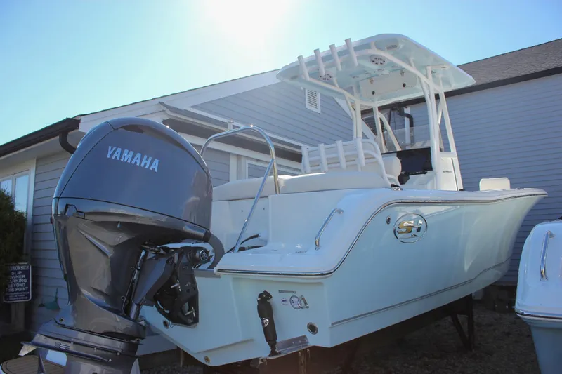 The Image of 2026 Sea Hunt Ultra 229 boat with Yamaha engine, displayed outdoors. - 0