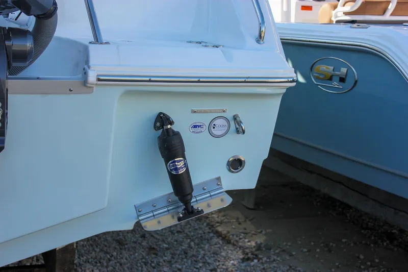 Slide: The Image of 2026 Sea Hunt Ultra 229 boat stern with brand logos and equipment details. - 11