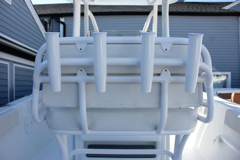 Slide: The Image of 2026 Sea Hunt Ultra 229 boat with rod holders and cushioned seating. - 25