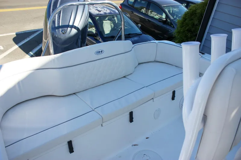 Slide: The Image of 2026 Sea Hunt Ultra 229 boat interior with white cushioned seating. - 3