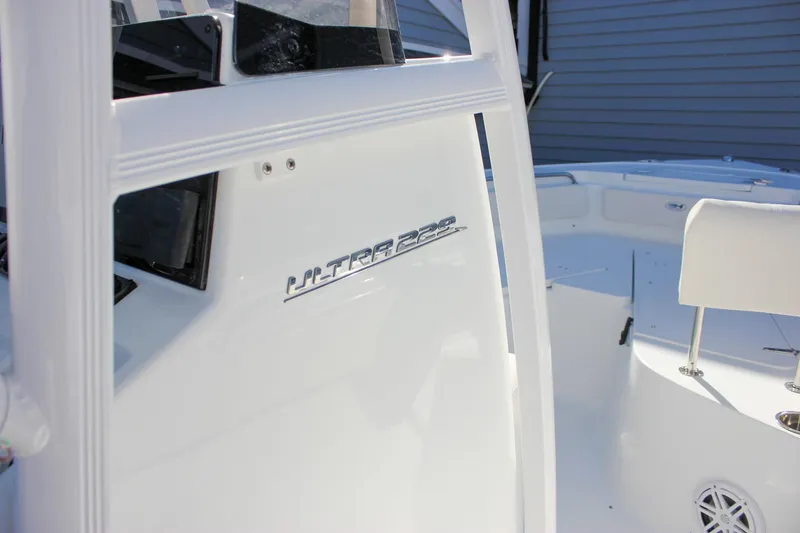 Slide: The Image of 2026 Sea Hunt Ultra 229 boat interior, showcasing sleek white design and seating. - 30