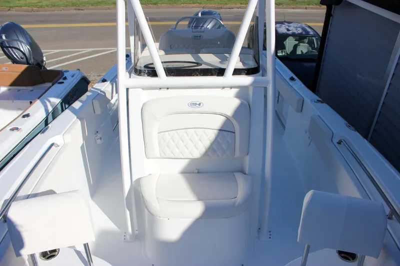 Slide: The Image of 2026 Sea Hunt Ultra 229 boat interior with white seating and sleek design. - 35