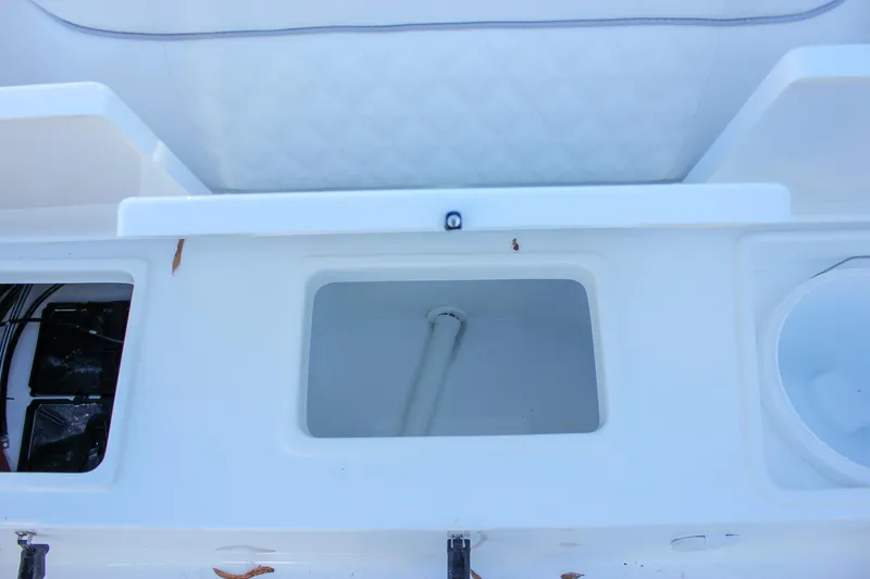 Slide: The Image of 2026 Sea Hunt Ultra 229 boat storage compartments and seating detail. - 40