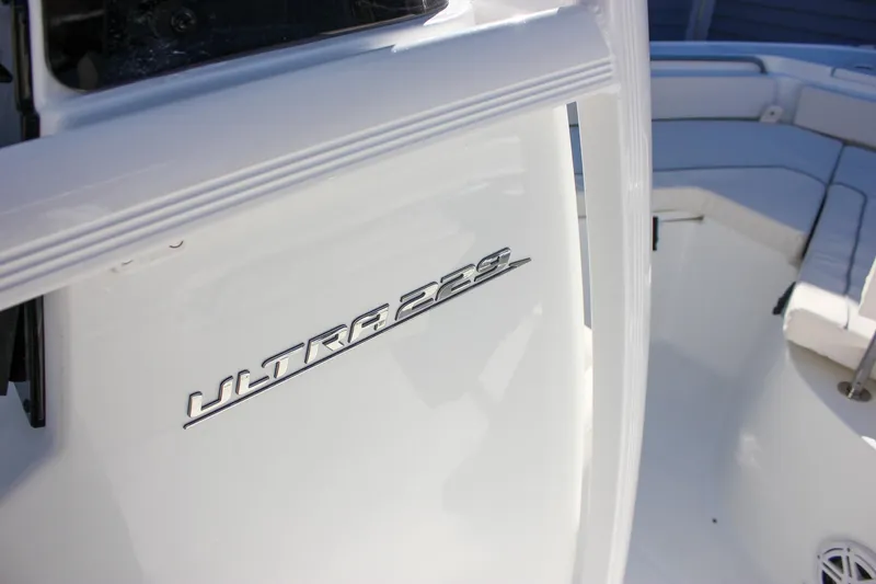 Slide: The Image of 2026 Sea Hunt Ultra 229 boat interior with model name visible on white surface. - 45
