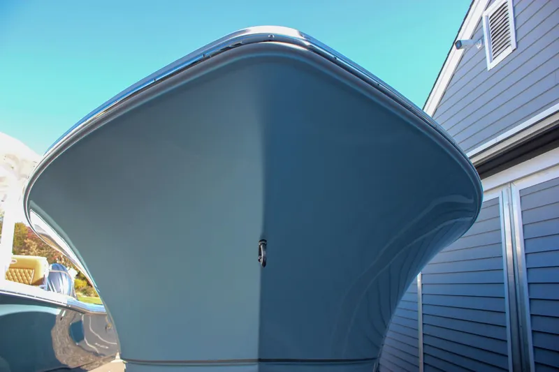 Slide: The Image of Front view of 2026 Sea Hunt Ultra 229 boat against a clear blue sky. - 53