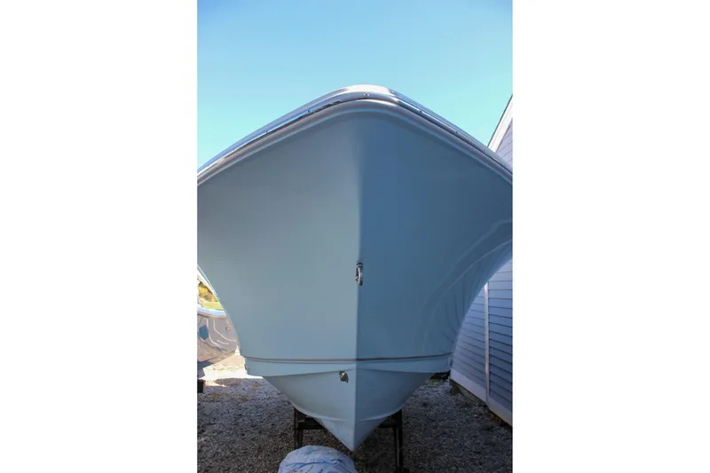 Slide: The Image of Front view of a 2026 Sea Hunt Ultra 229 boat, showcasing its sleek hull design. - 54