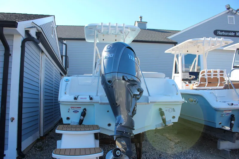 Slide: The Image of 2026 Sea Hunt Ultra 229 boat with Yamaha engine, docked near Harborside Marina. - 7