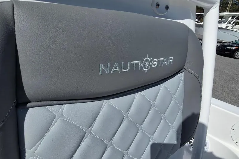 Slide: The Image of 2026 NauticStar 224 Bay boat seat with logo and quilted design. - 11