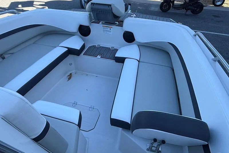 Slide: The Image of 2026 Starcraft SVX 191 OB boat interior with white cushioned seating. - 13