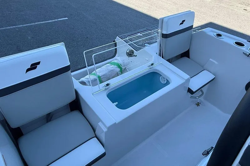 Slide: The Image of 2026 Starcraft SVX 191 OB boat interior with seating and storage compartments. - 15