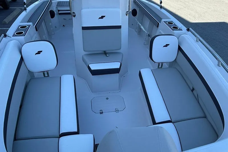 Slide: The Image of 2026 Starcraft SVX 191 OB boat interior with white and gray seating, cup holders, and sleek design. - 8