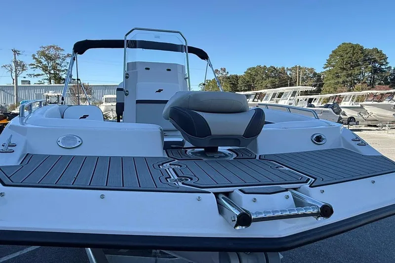 Slide: The Image of 2026 Starcraft SVX 191 OB boat with sleek deck design and comfortable seating. - 9