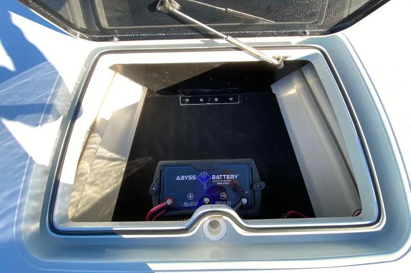 Slide: The Image of 2024 Drake Boatworks Nomad battery compartment with Abyss lithium battery. - 24