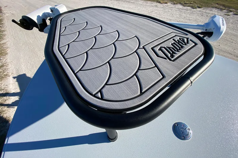 Slide: The Image of 2024 Drake Boatworks Nomad with custom deck design and logo detail. - 25