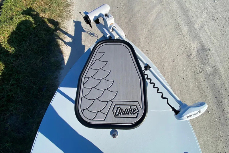 Slide: The Image of 2024 Drake Boatworks Nomad deck with fish scale design and trolling motor. - 27