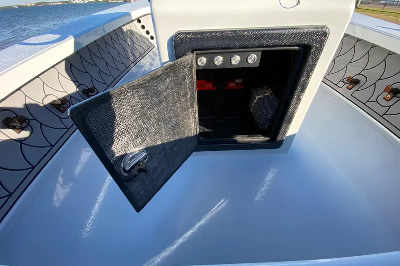 Slide: The Image of 2024 Drake Boatworks Nomad with open storage compartment, showcasing interior design and functionality. - 41
