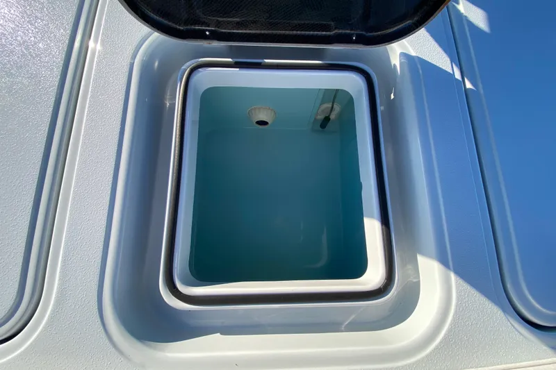 Slide: The Image of 2024 Drake Boatworks Nomad livewell with open lid, showcasing interior design. - 54