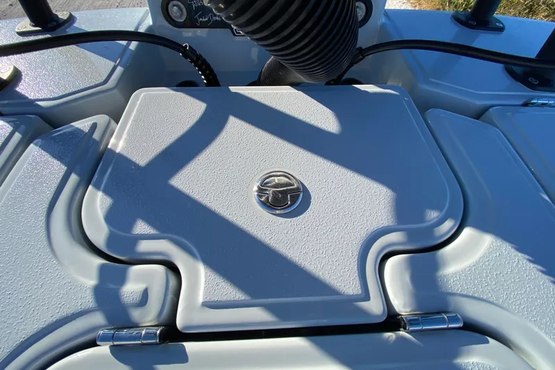 Slide: The Image of 2024 Drake Boatworks Nomad deck detail with textured surface and latch. - 59